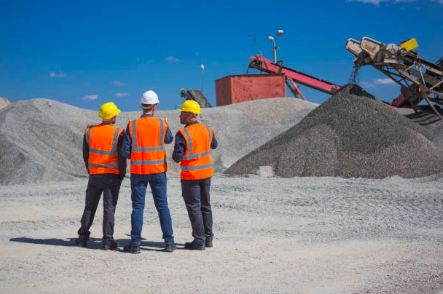 Workers at the gravel open pit mine